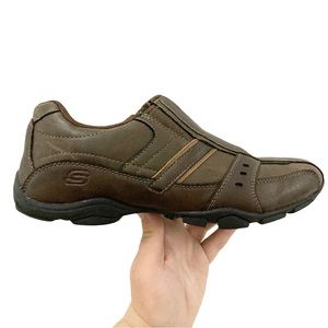 Skechers garzo brown sales